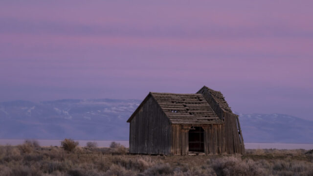 Weathered Barn at Dusk Weathered abandoned barn at dusk in Honey Lake Valley, Lassen County, California, with a pink and purple high-cloud sky and Honey Lake visible beyond