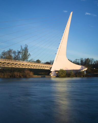 Sundial Bridge Pylon at in Morning Light - Redding - Shasta County California Close-up of the Sundial Bridge pylon and cable stays rising above the Sacramento River at Turtle Bay Exploration Park in Redding, California, in warm morning light.