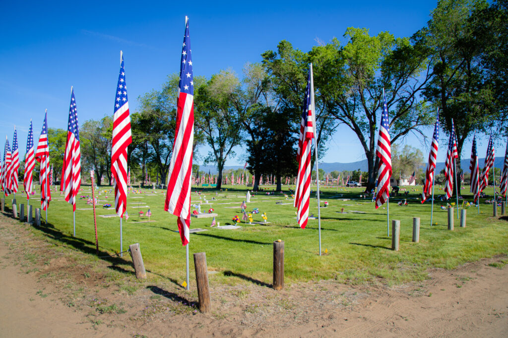 Rows of American flags fill Diamond Crest Cemetery in Johnstonville CA during the Memorial Day Avenue of Flags
